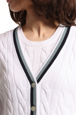 White cable knit cardigan with blue and black stripes on the hem close up front view