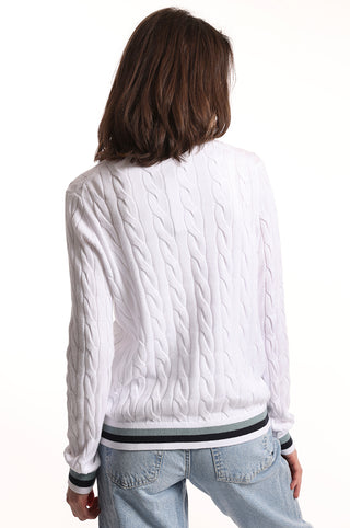White cable knit cardigan with blue and black stripes on the hem back view