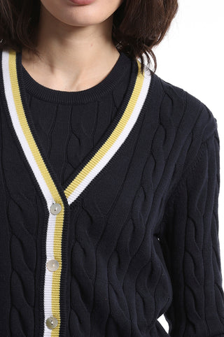 Close up of Navy cable knit cardigan with white and yellow stripes on the hem
