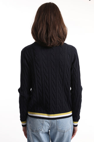 Navy cable knit cardigan with white and yellow stripes on the hem back