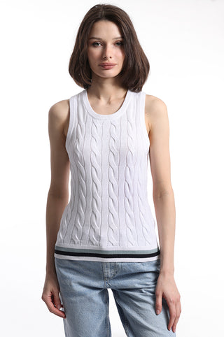 Model wearing white cable knit sweater tank top with blue white and black stripe detail on bottom hem