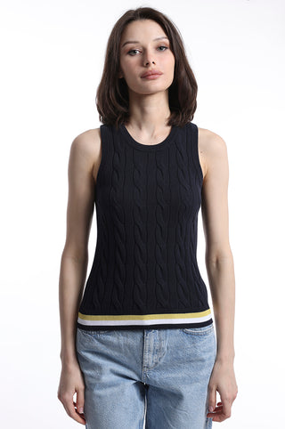 Model wearing navy cable knit sweater tank top with yellow, white and navy stripe detail on bottom hem
